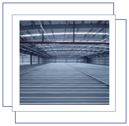 A photo showing a large warehouse being kitted out with racking.